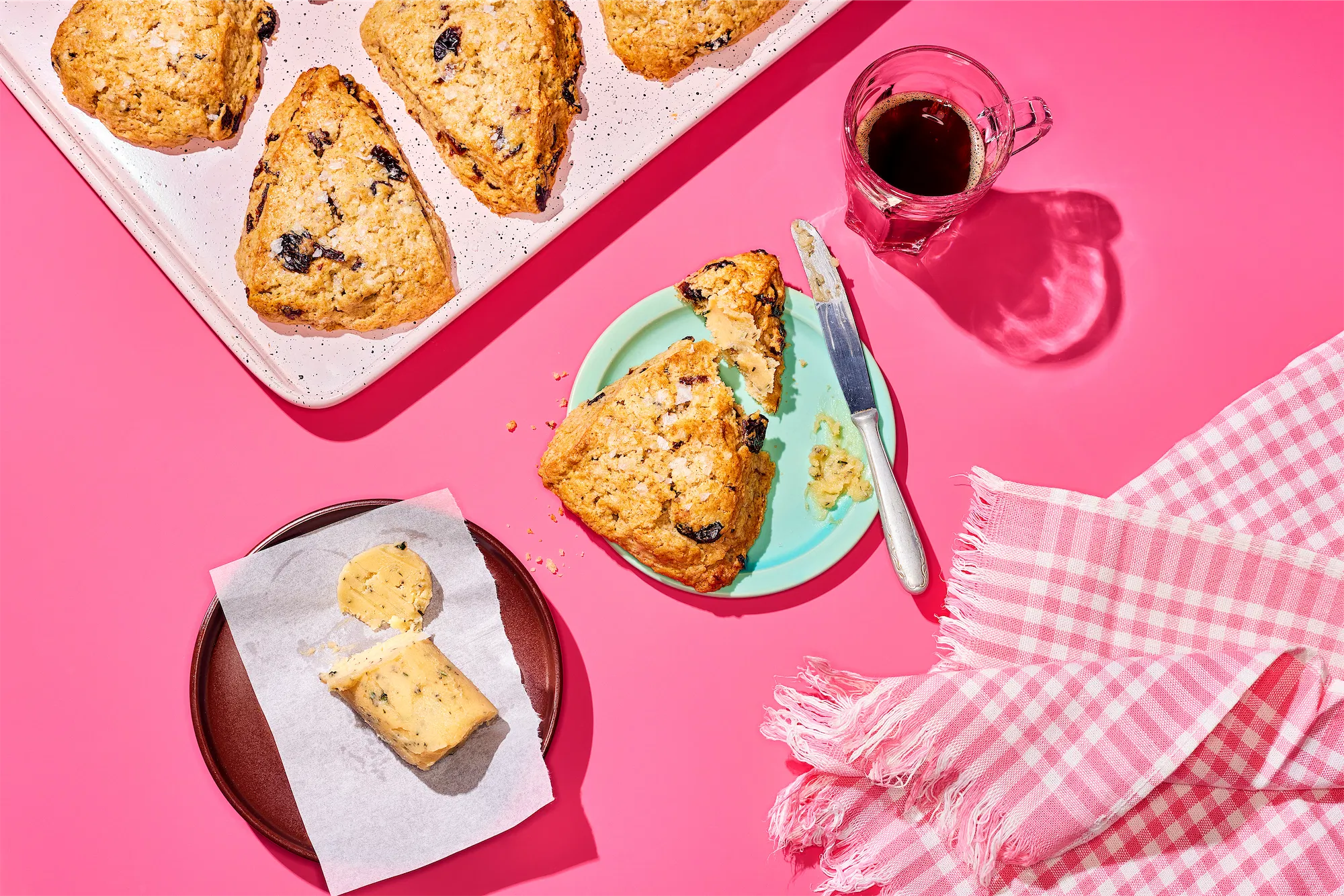 Cabot brand recipe scones with butter on a pink background and espresso cup