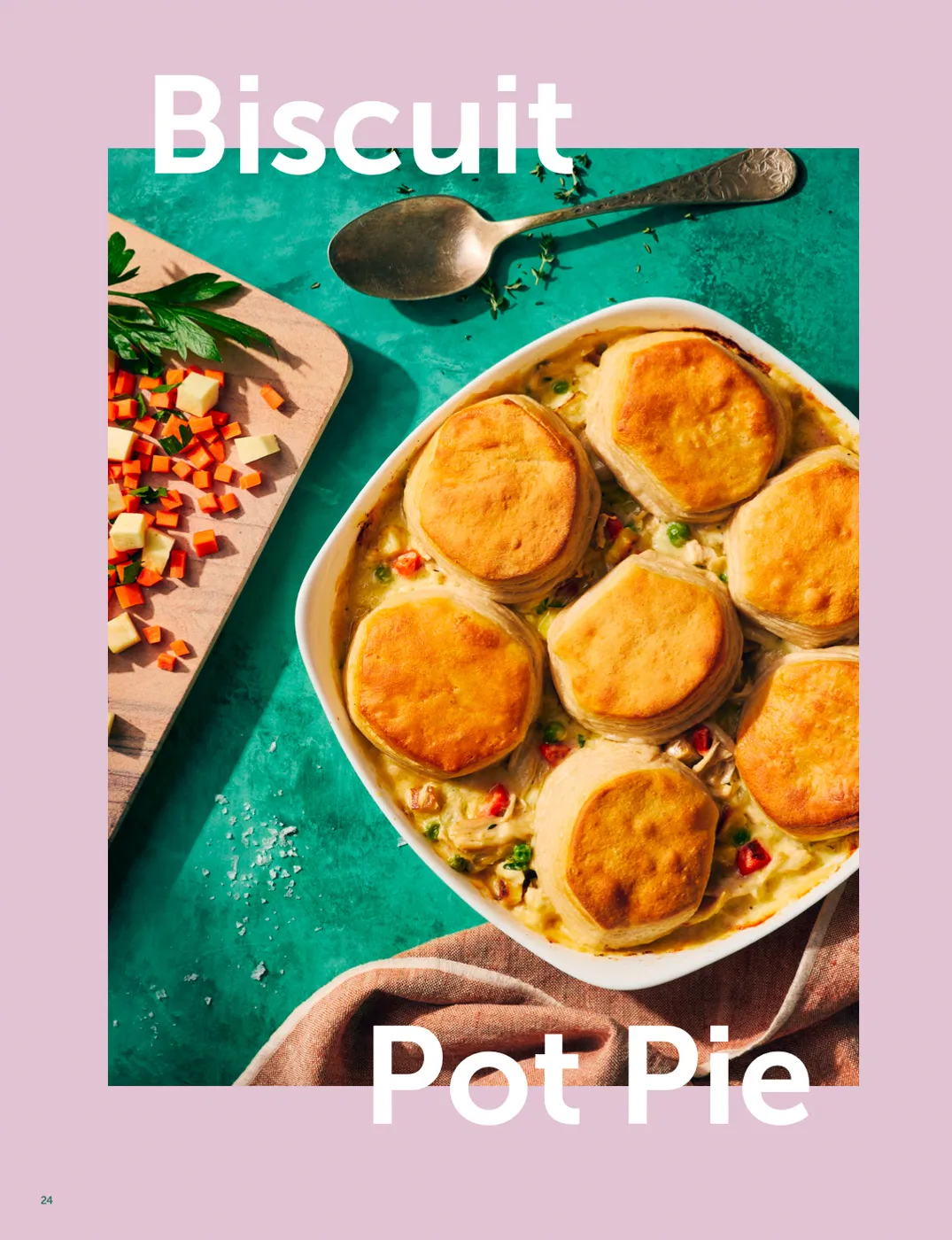 biscuit pot pie in baking dish with serving spoon on a green background