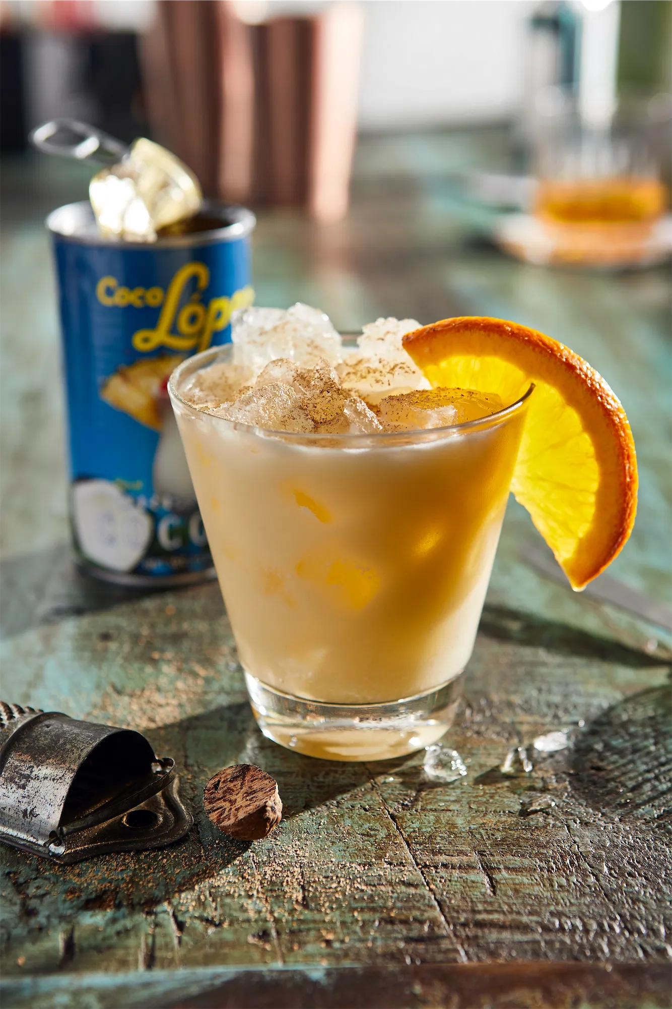 Andy Murray cookbook painkiller cocktail recipe with coconut cream and half ornage wheel as garnish