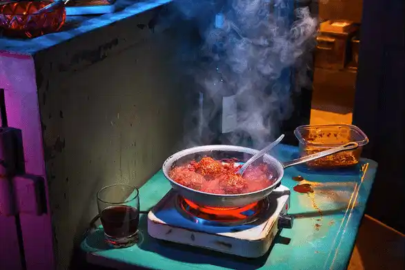 meatballs simmering in tomato sauce