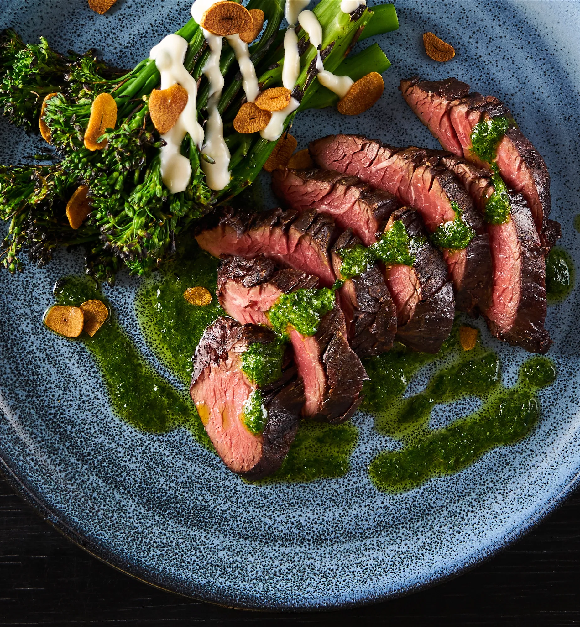 hanger steak with chimichurri brocolli rabe and garlic