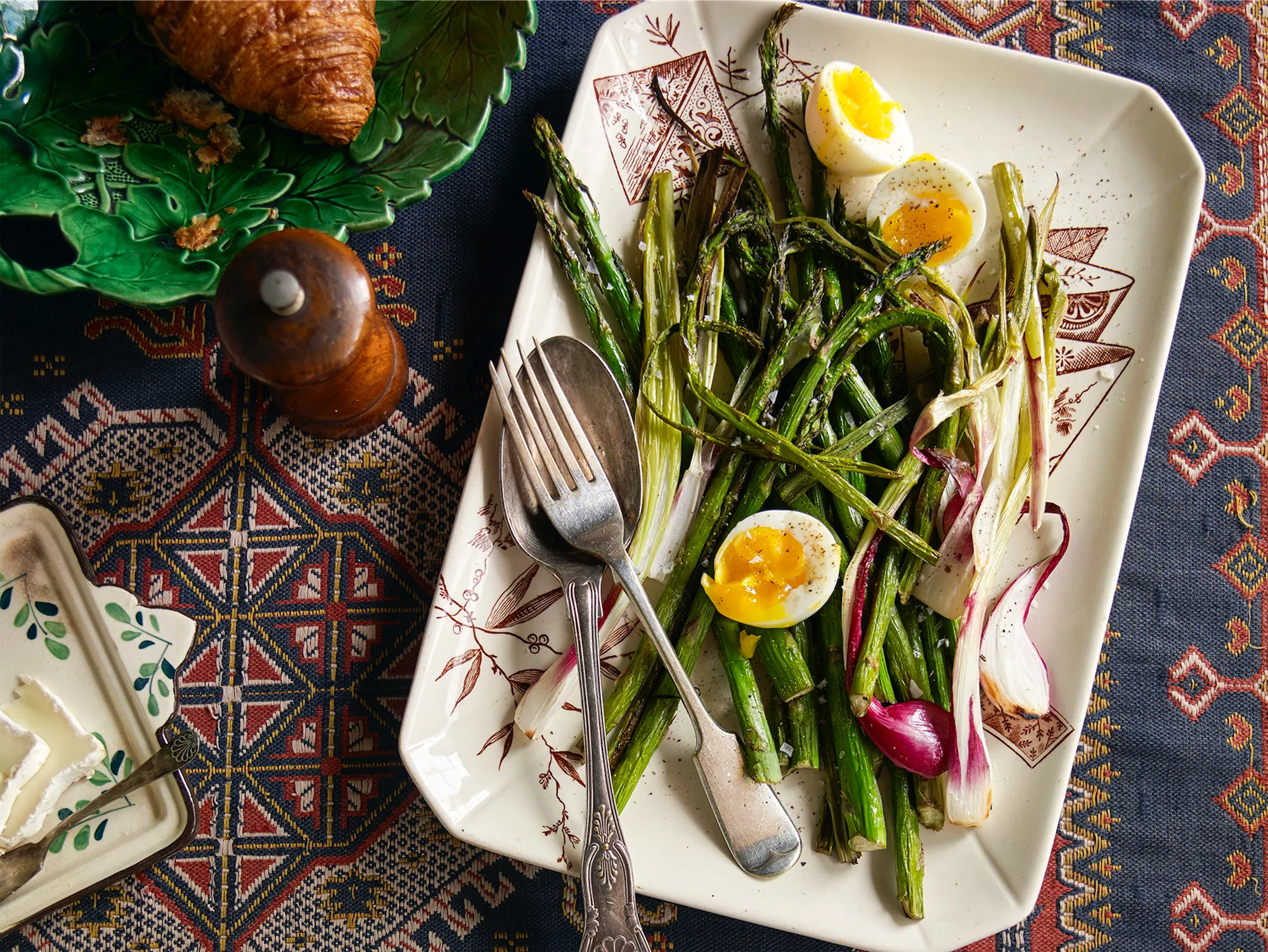 vintage platter filled with asparagus and soft boiled eggs majolica plate