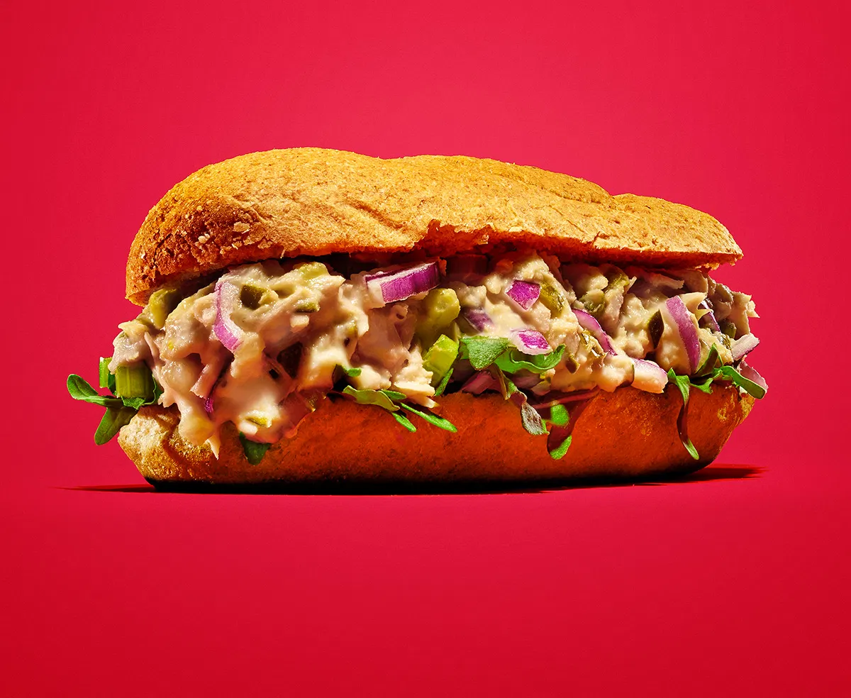 heroic sub sandwich with tuna salad on a red background for kraft brand
