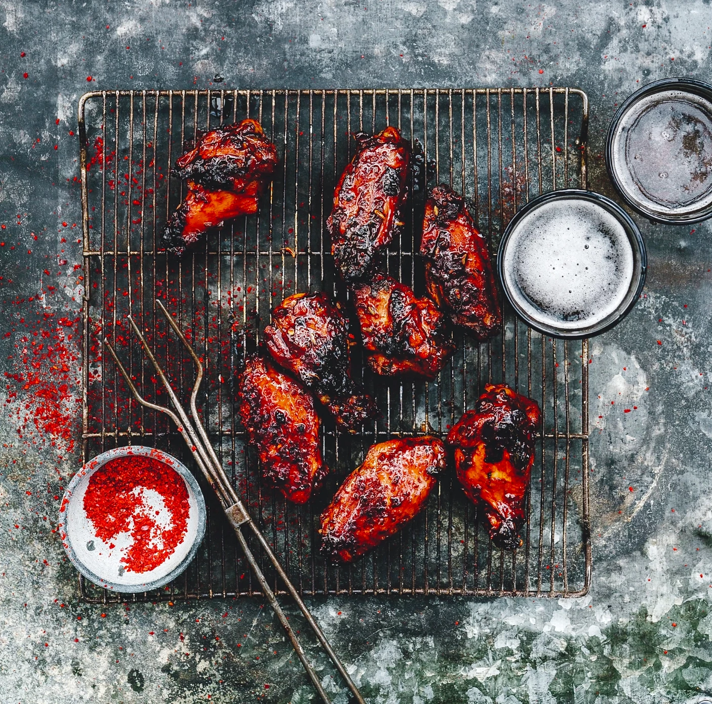 spicy red chicken wings on a wire rack
