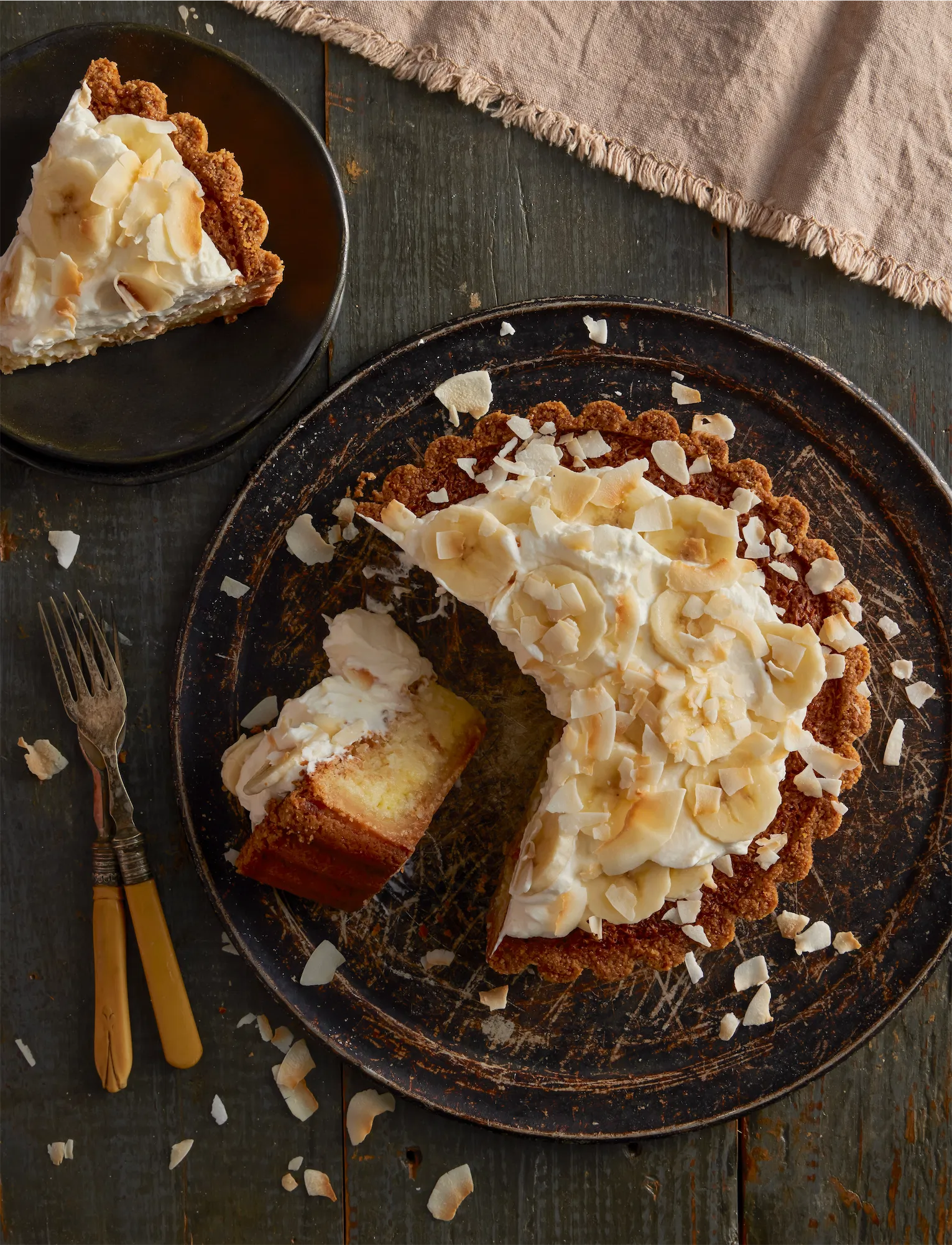 banana cream pie with coconut a slice cut on its side