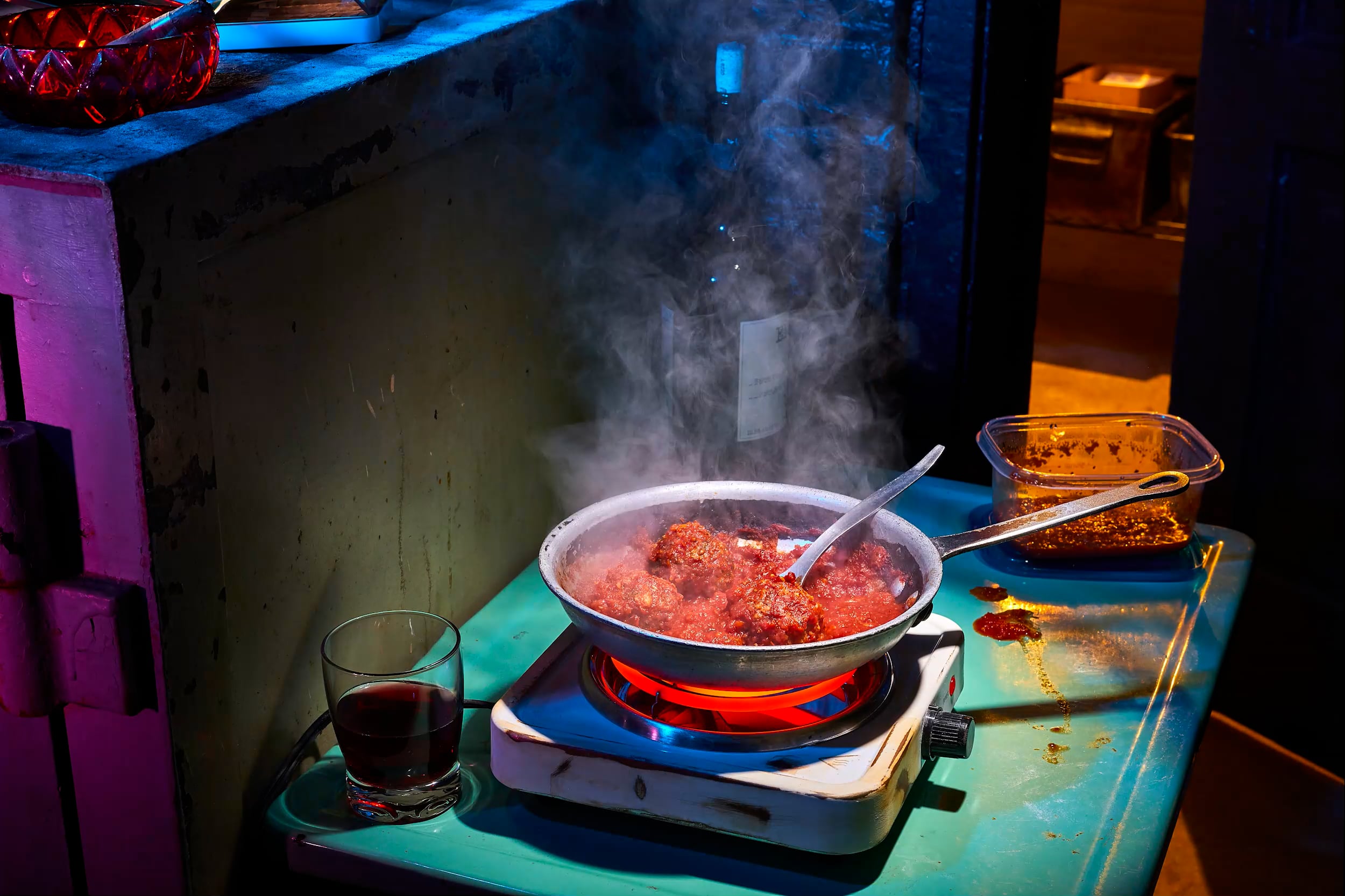 meatballs simmering in tomato sauce
