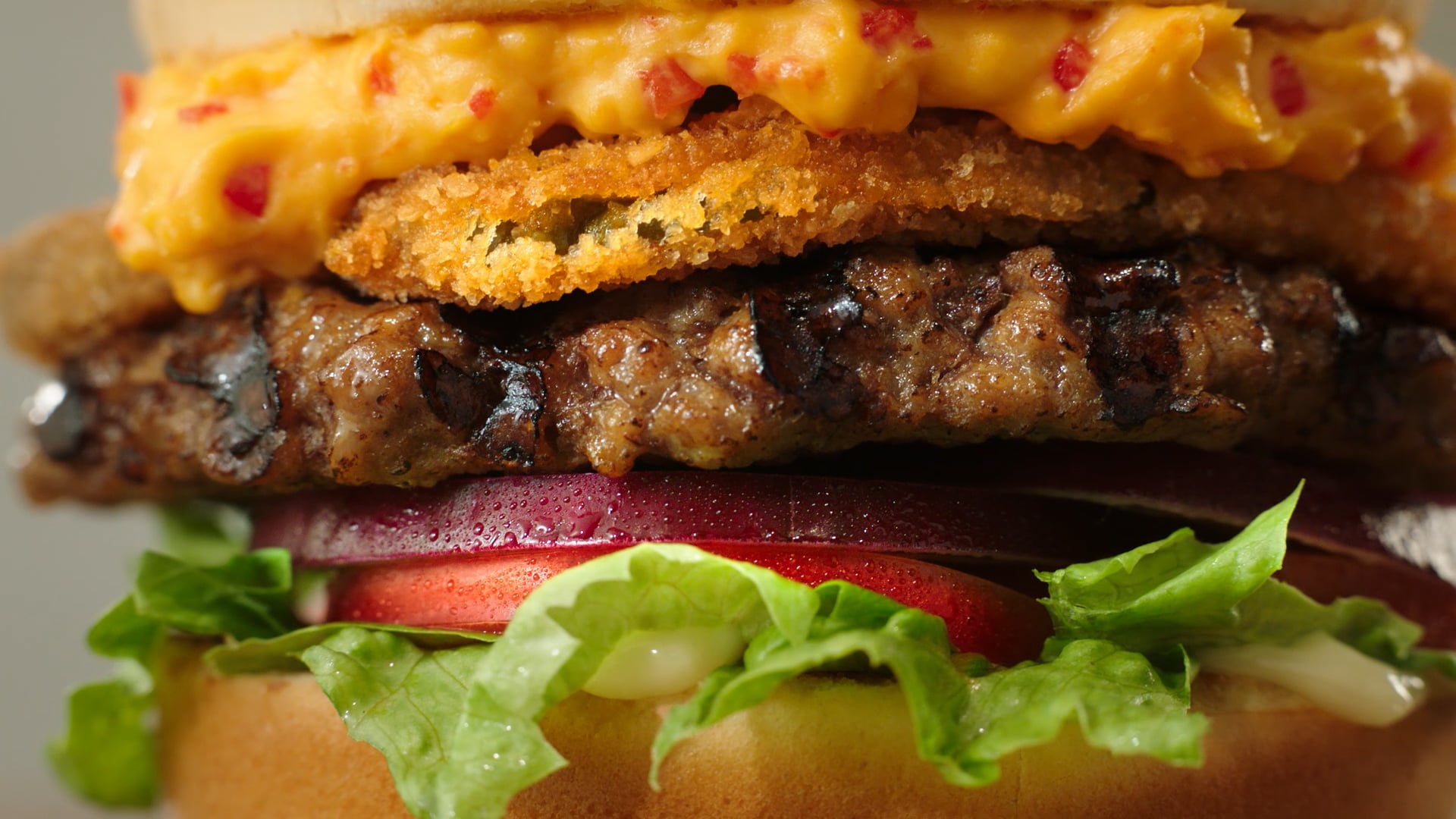 Hardees brand southern fried burger with pimento cheese and fried pickles
