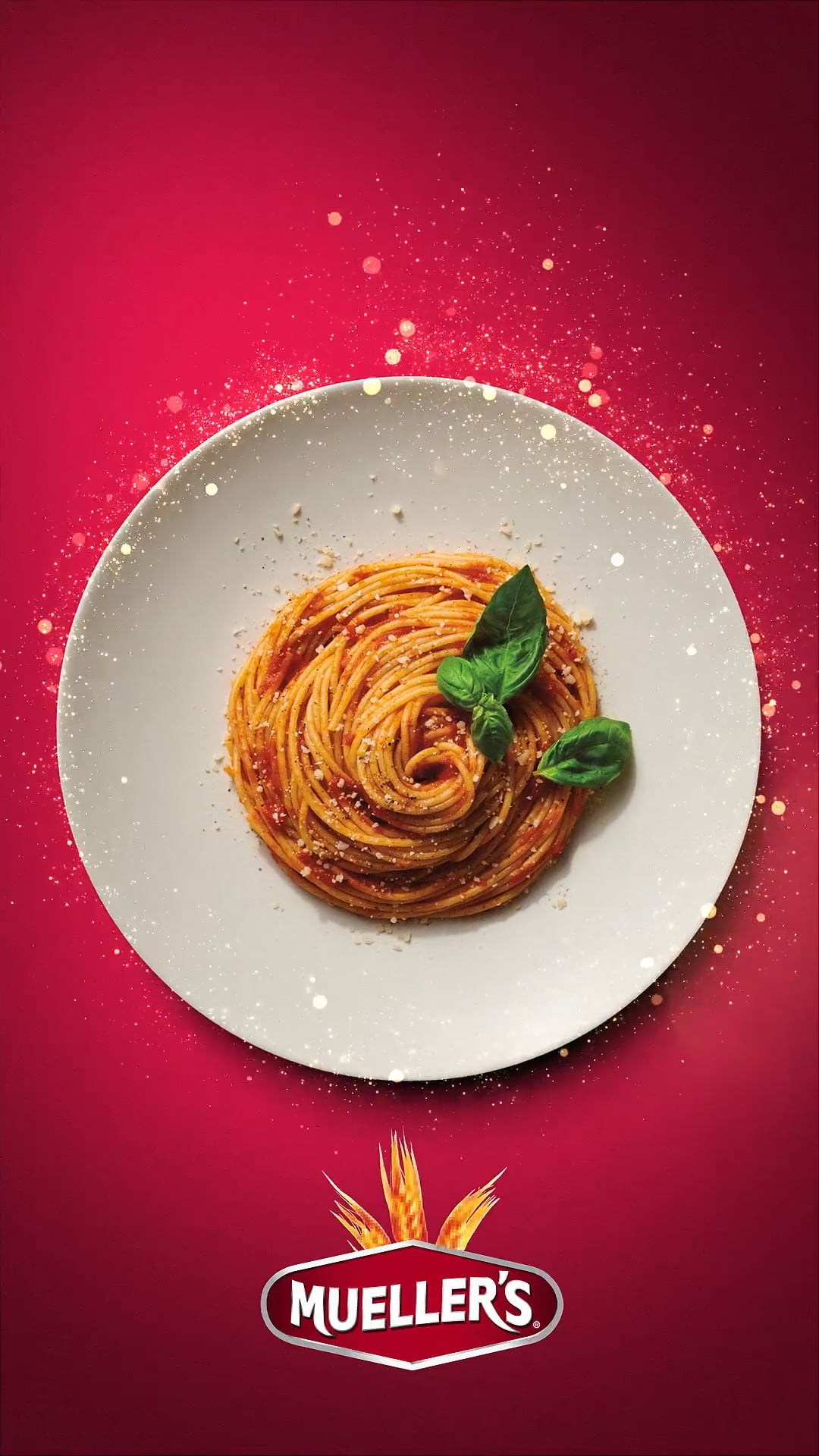 Muellers brand spaghetti pasta in a white bowl on a red background to make your famils day