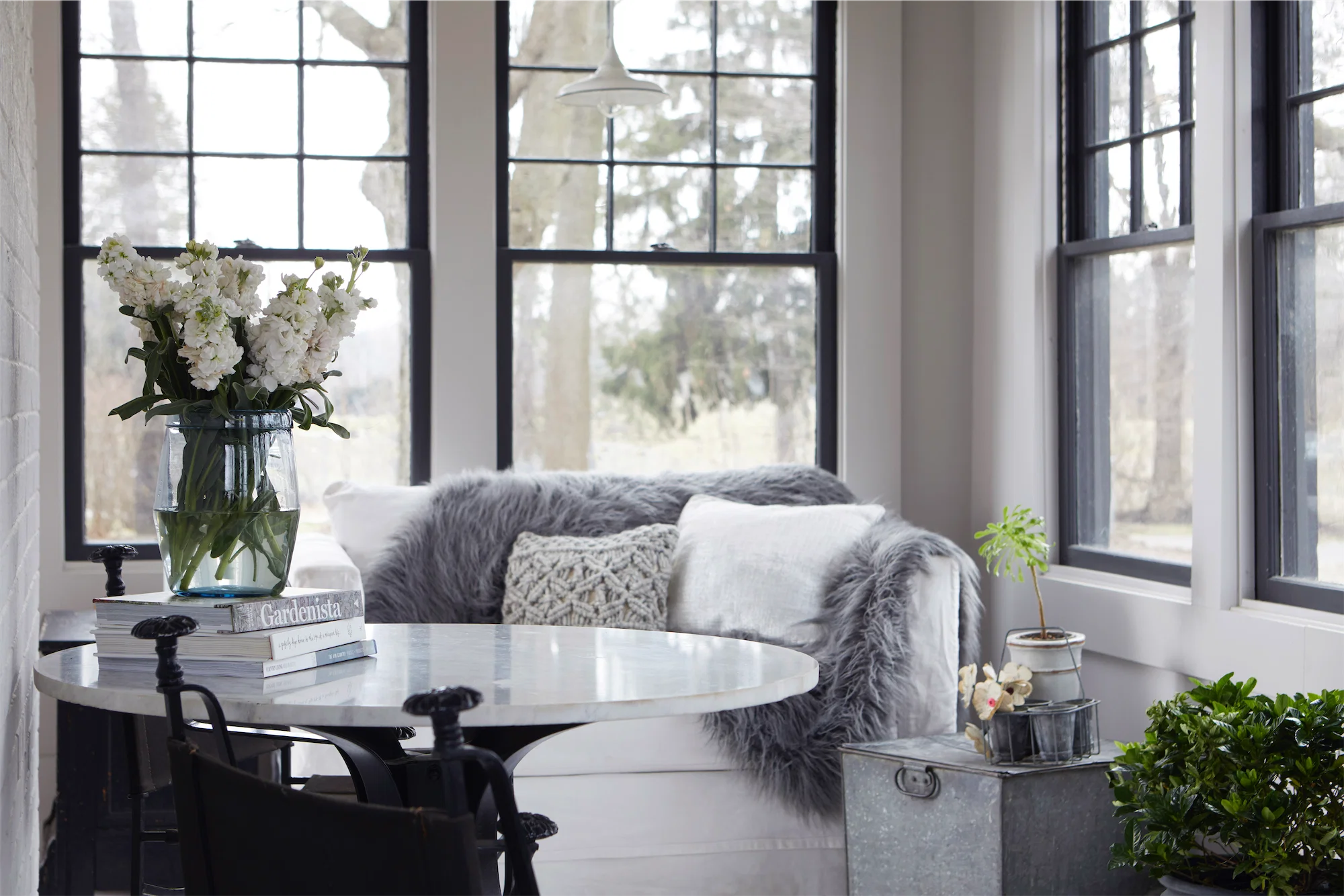 Tasteful old house black and white sash windows marble table botanicals