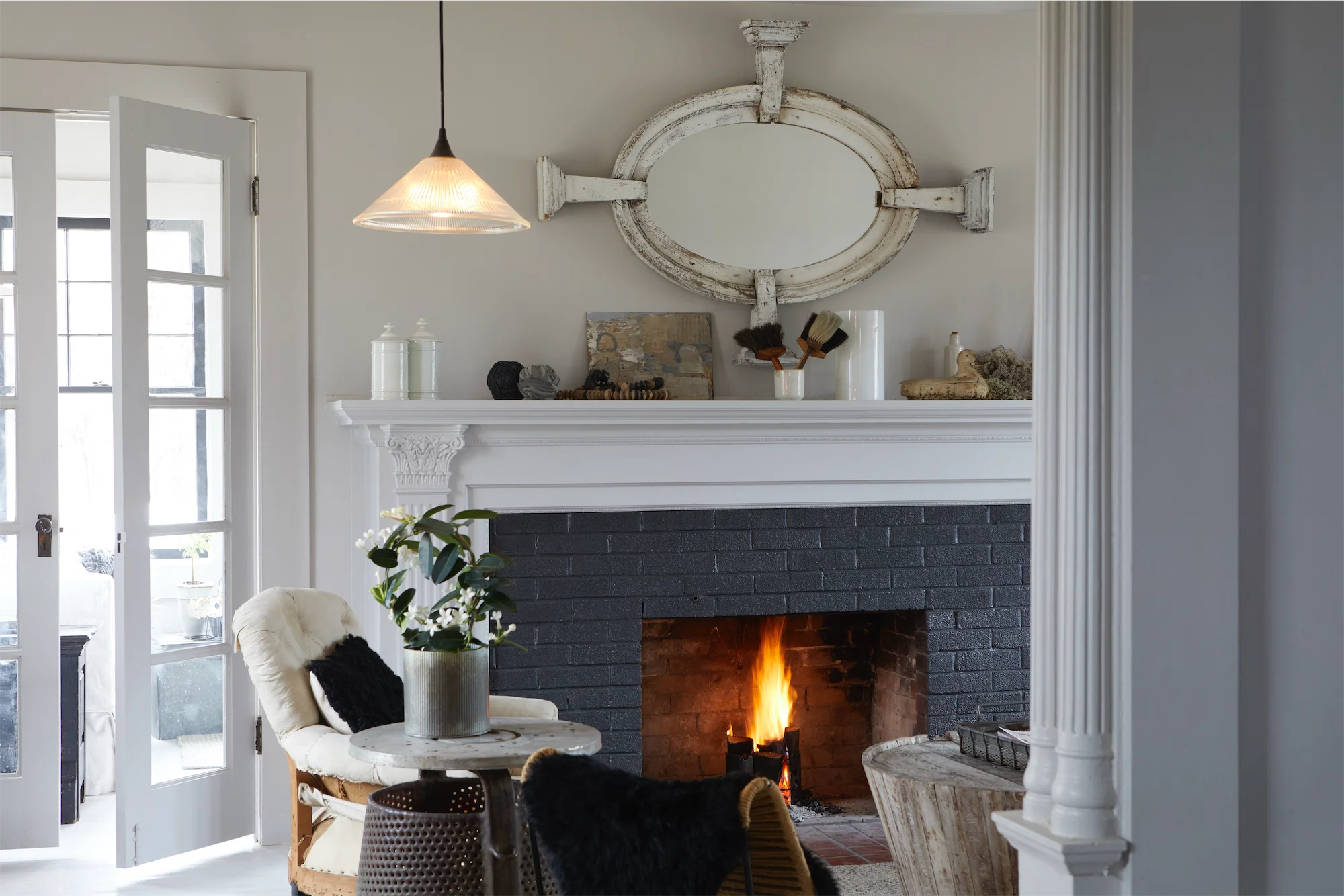tasteful white gray black interior living room fireplace french doors