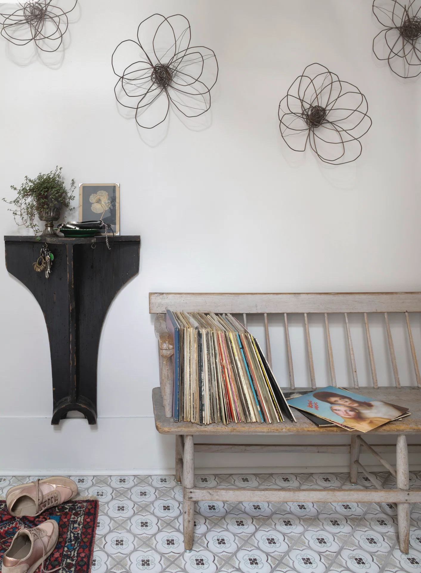 interior scene antique parsons bench industrial mold hall stand lucy slivinski wire flowers vintage albums vinyl