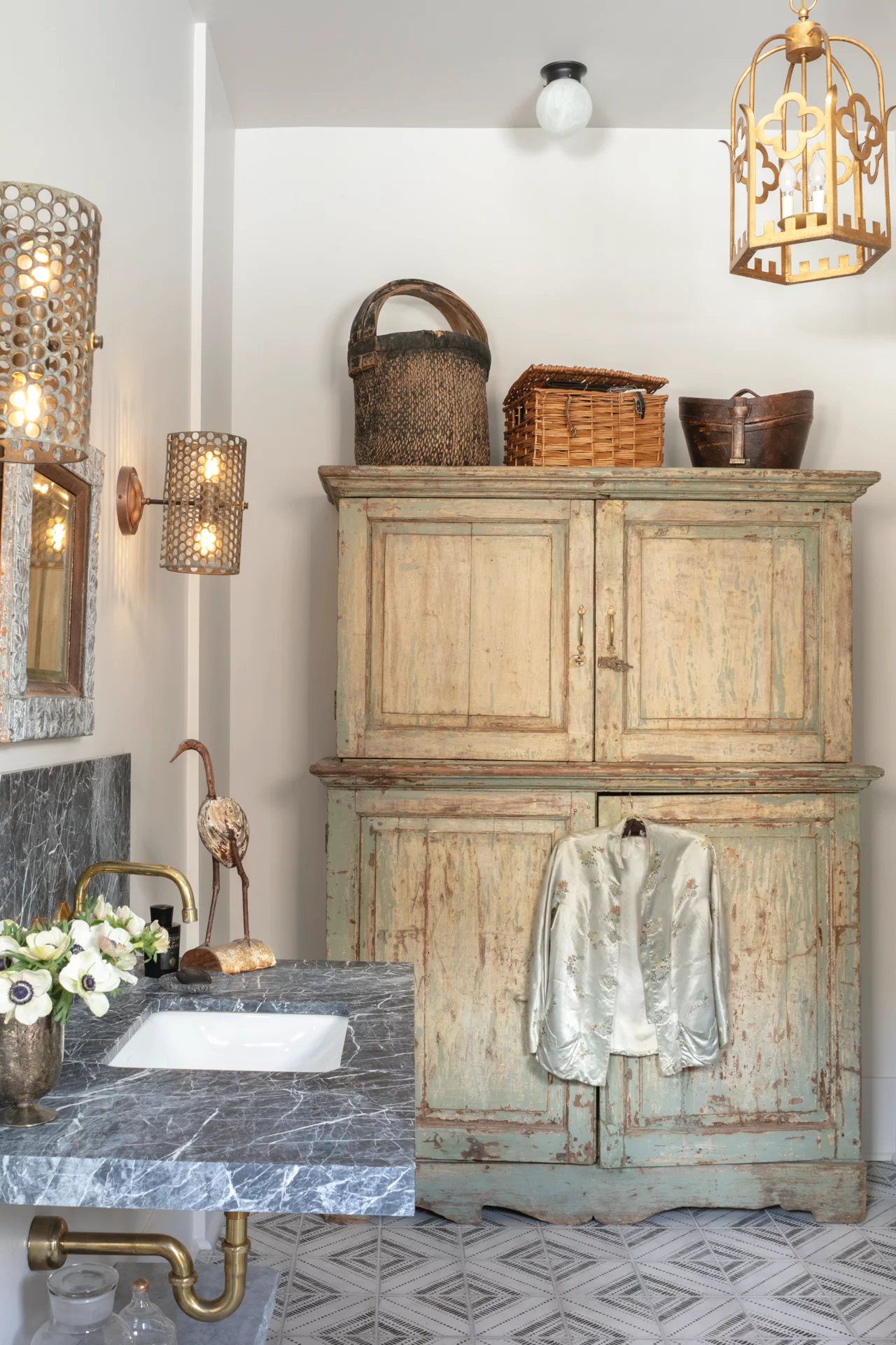 interior bathroom marbel sink oversized cabinet baskets metal sconces chinese silk jacket gilt chandelier